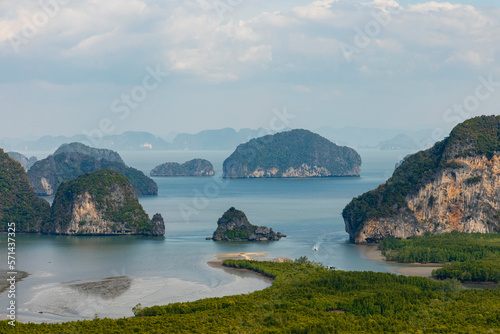 Samet Nangshe viewpoint at the south of Thailand during the daytime under the sunlight with the cloudy grey sky with the view of the rocks in Phang Nga Bay 