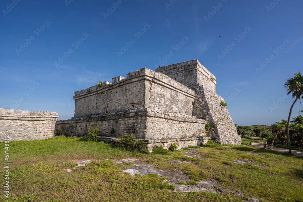 The ruins of a beautiful pyramid in the archaeological zone of Tulum in Mexico.