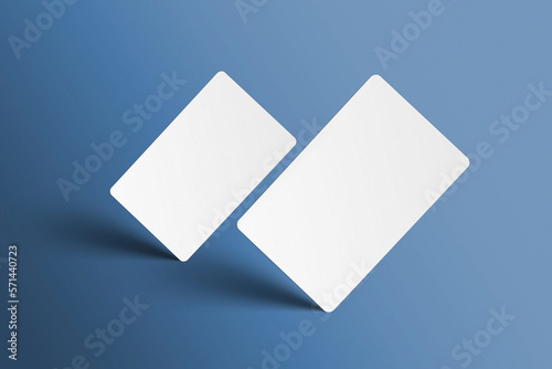 Mockup of 2 universal gift cards in  perspective on isolated blue colour background. 3D render mock up business cards standing on the corner with shadows. Invite, identity, stationery, empty mock-up