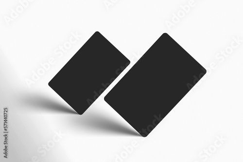 A mockup of 2 universal black gift cards in  perspective on isolated blue colour background. 3D render mock up business cards standing on the corner with shadows. Invite, identity, stationery, empty
