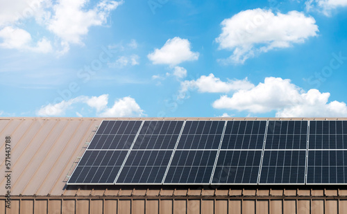 Solar cell panel on roof with blue sky and cloud background