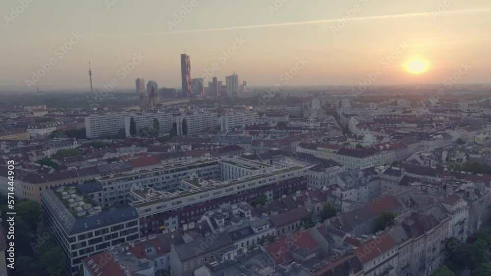 Flying above the houses of the Capital of Austria, Vienna during sunset. Flying above the houses of the Capital of Austria, Vienna during sunset.