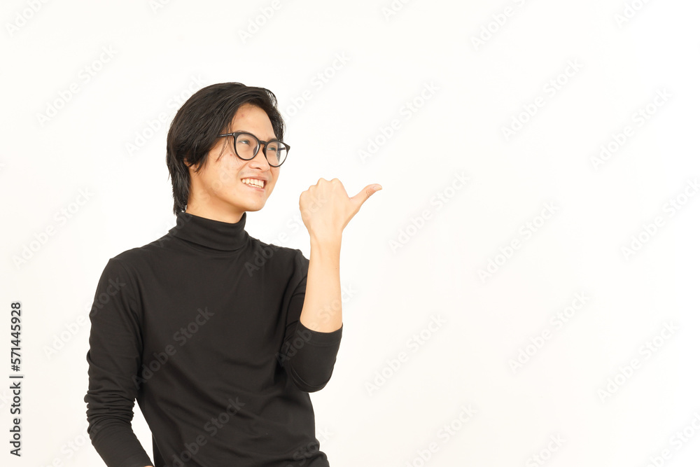 Presenting and Pointing Side Product Using Thumb Of Handsome Asian Man Isolated On White Background Presenting and Pointing Side Product Using Thumb Of Handsome Asian Man Isolated On White Background