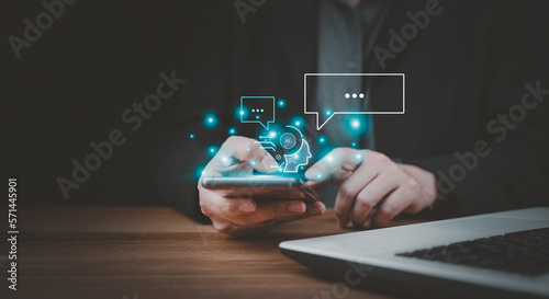 Businessman using chatbot in smartphone intelligence Ai. Chat GPT with AI Artificial Intelligence, developed by OpenAI generate. Futuristic technology, robot in online system. Database smart chatbox.