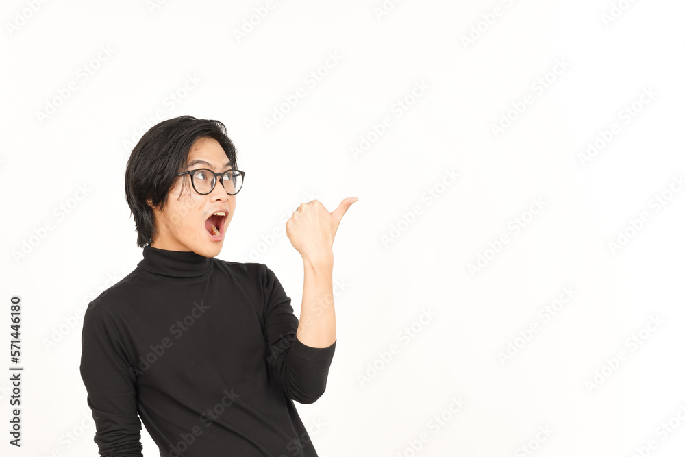 Presenting and Pointing Side Product Using Thumb Of Handsome Asian Man Isolated On White Background Presenting and Pointing Side Product Using Thumb Of Handsome Asian Man Isolated On White Background