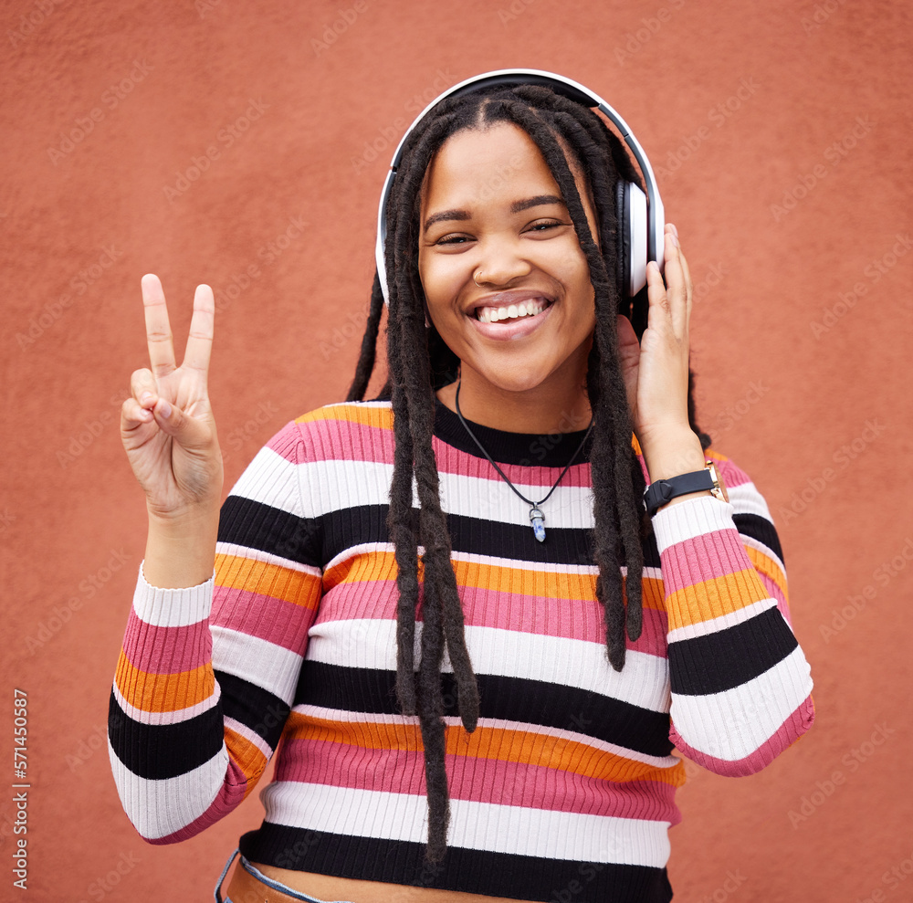 Φωτογραφία Portrait, headphones and black woman with peace sign isolated on orange wall for gen z music or mental health