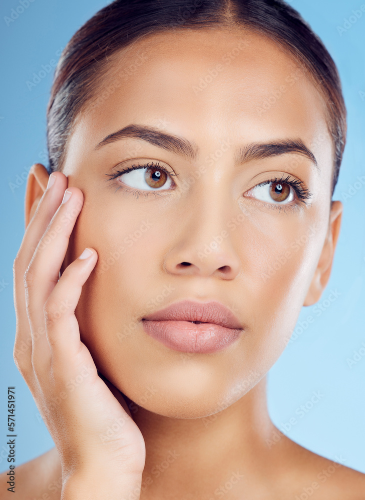 Skincare, beauty and woman in a studio with a natural, organic and cosmetic facial treatment. Self care, cosmetics and female model from Brazil with a fresh skin or face routine by a blue background.