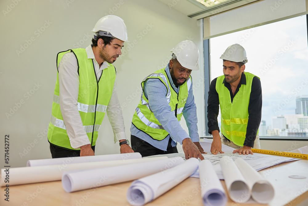 group of engineers meeting and talking about work or projects on construction site group of engineers meeting and talking about work or projects on construction site
