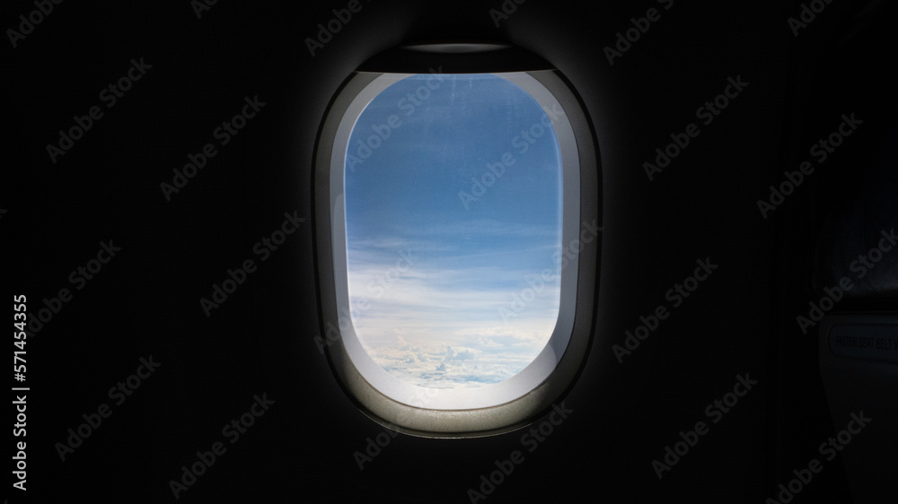 View from the window on the plane, looking out the window looking at the clouds in the air, travel concept.