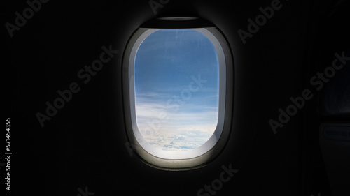 View from the window on the plane, looking out the window looking at the clouds in the air, travel concept.