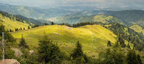 Mountain green valley in Almaty mountains, famous hiking trail in Kazakhstan.
