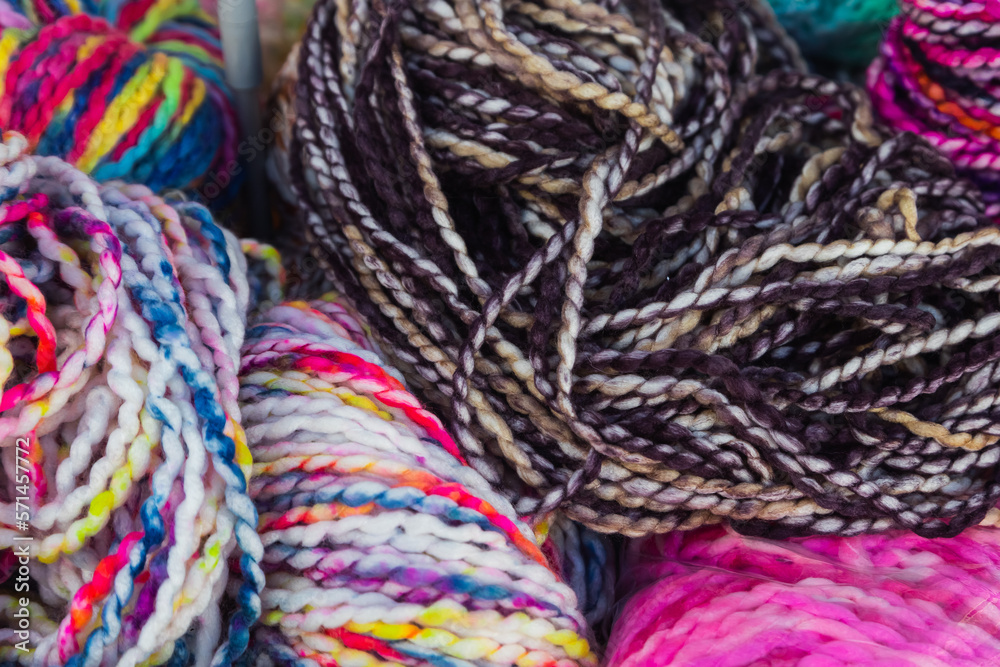 Close Up of colorful yarn balls. natural wool knitting background. knitting yarn for handmade winter clothes. Close Up of colorful yarn balls. natural wool knitting background. knitting yarn for handmade winter clothes.