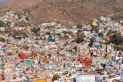 Very beautiful view of the city at sunset in the Mexican city of Guanajuato surrounded by large mountains. © nikwaller