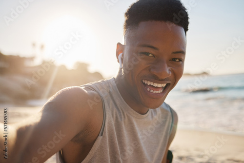 Selfie, beach and fitness with a sports black man outdoor during summer for a cardio or endurance workout. Portrait, nature and exercise with a male runner or athlete training outside for health