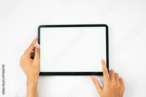 hands holding blank screen tablet for mockups
