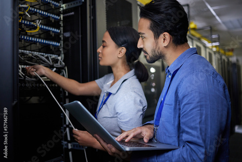 Man, woman or server room maintenance on laptop IT, software programming ideas or cybersecurity engineering. People, repair or data center technology in teamwork collaboration of safety analytics fix