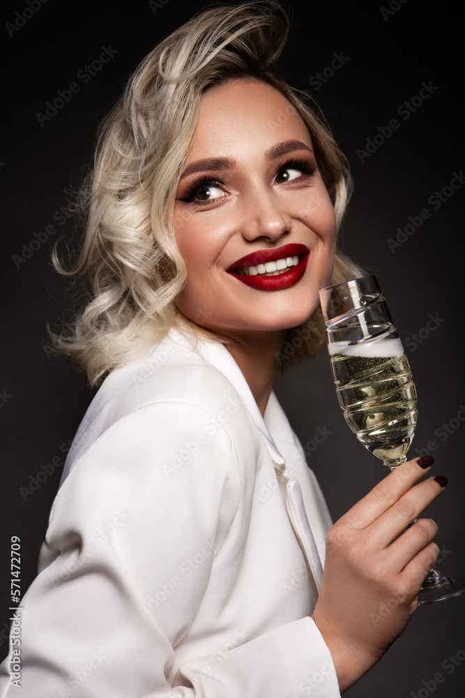 Close up portrait of pretty blond female handling prosecco. Beautiful makeup with red lips. Close up portrait of pretty blond female handling prosecco. Beautiful makeup with red lips.
