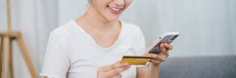 Young asian woman hand using mobile phone and credit card for online payment, electronic wallet. Young asian woman hand using mobile phone and credit card for online payment, electronic wallet.