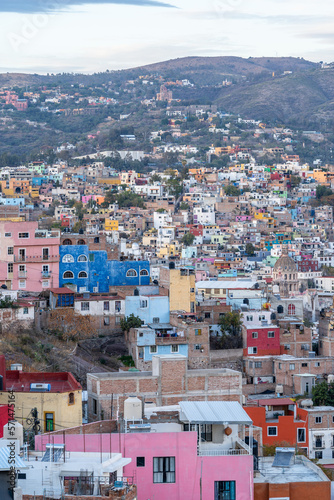 Very beautiful view of the city at sunset in the Mexican city of Guanajuato surrounded by large mountains. © nikwaller