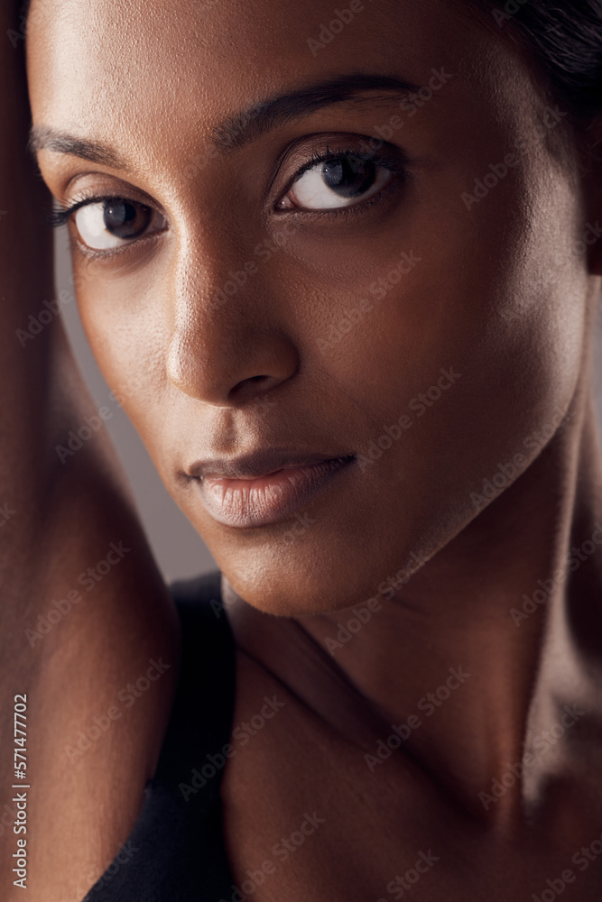 Indian woman, beauty and skincare portrait of a young model with skin glow from facial. Cosmetics, face and person with wellness and spa care after dermatology, detox and treatment in a studio