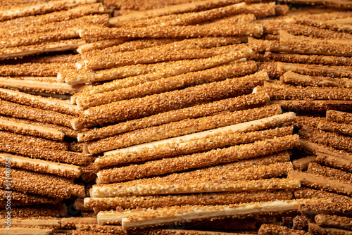 Pretzel bread sticks with sesame seeds. Delicious pretzels in bulk. close up