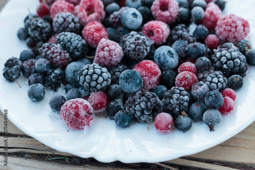 Frozen berries in a bowl, close-up Frozen berries in a bowl, close-up