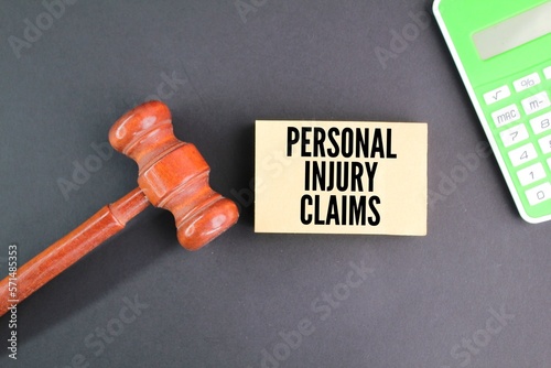 judge's gavel, calculator and paper with the words PERSONAL INJURY CLAIMS