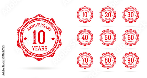 Set of anniversary logos from 10 to 90 years old, drawn as stamps, red celebration frames. Grunge style rubber stamp texture. Postage stamp collection. Vector round stamps for holiday event