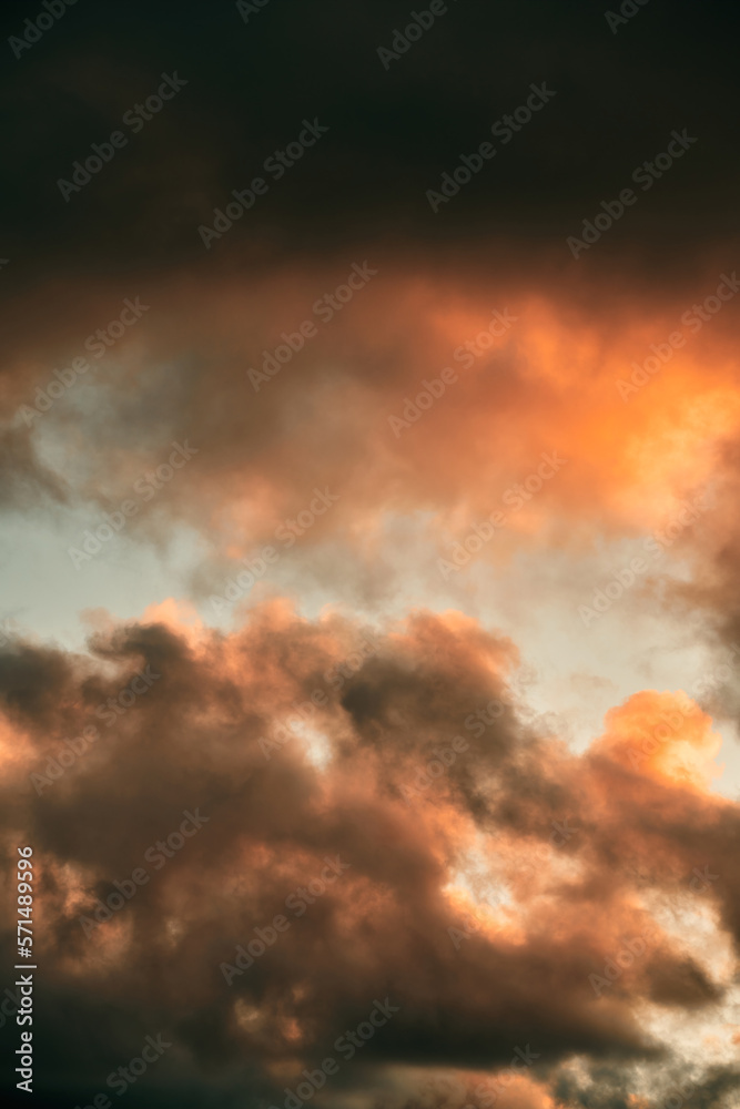 Cumulus sunset clouds with the sun setting down. Amazing sky summer evening background. Cumulus sunset clouds with the sun setting down. Amazing sky summer evening background.