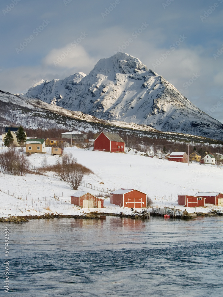 Village and mountains by the coast in Northern Norway