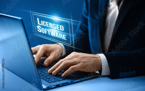 Fotografia Licensed software concept. Businessman uses licensed software