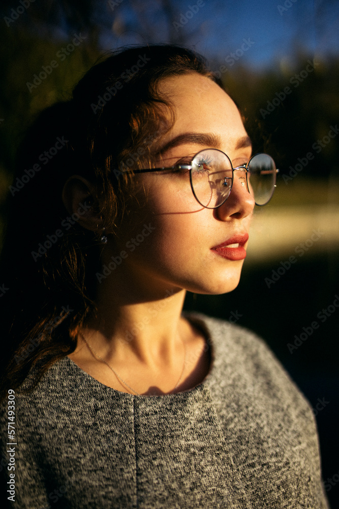 Profile portrait of a young woman in a gray coat Profile portrait of a young woman in a gray coat
