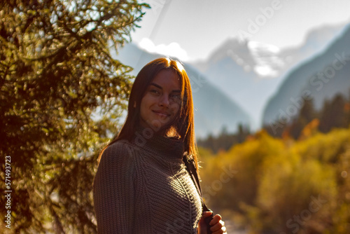 Nice Girl traveler in the background of the mountains photo