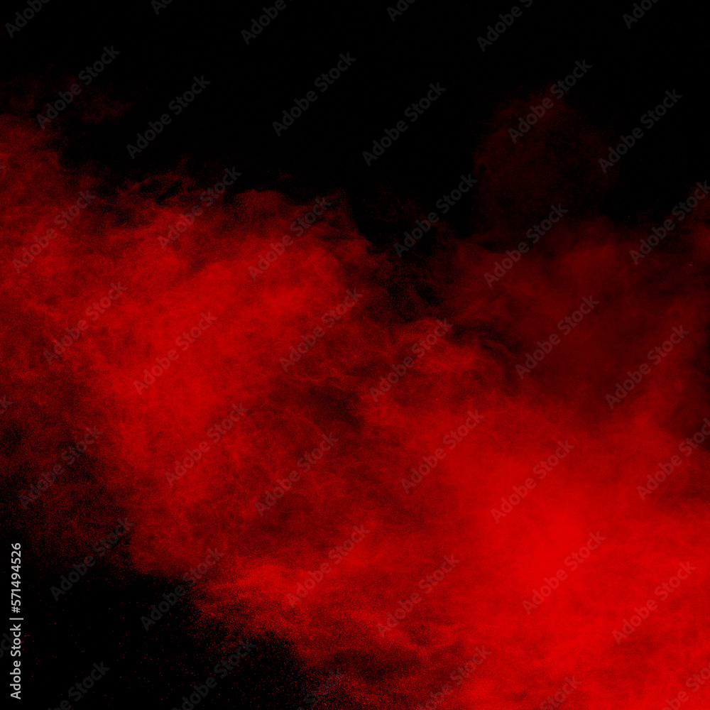 Fototapeta premium Red color powder explosion on black background.Freeze motion of red dust particles splashing.