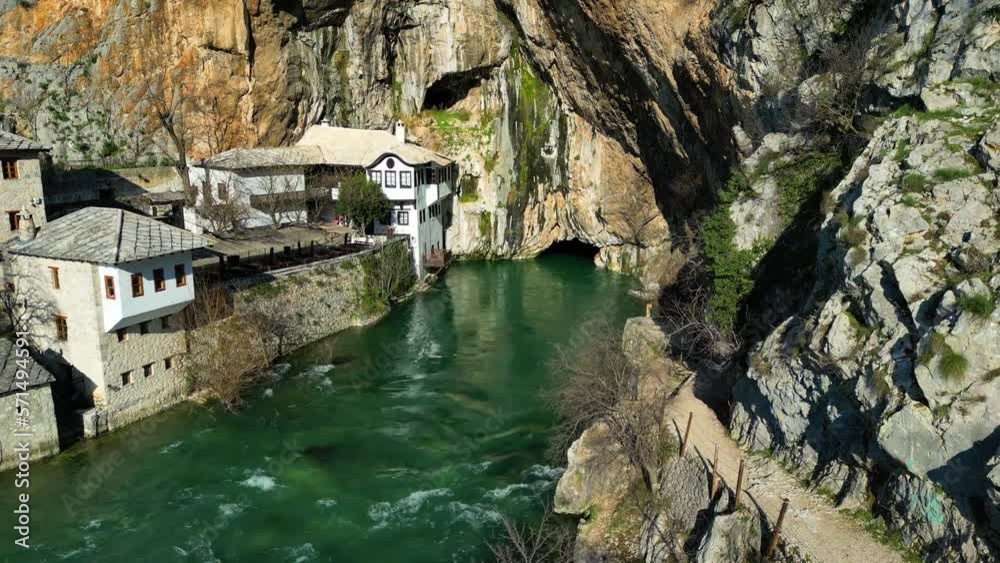 Aerial drone view of Tekija in Blagaj in BiH. The Tekija, dervish house, set at the source of the river Buna, was and still is a venue for dervish Zikr praise-chanting three nights weekly. Aerial drone view of Tekija in Blagaj in BiH. The Tekija, dervish house, set at the source of the river Buna, was and still is a venue for dervish Zikr praise-chanting three nights weekly.