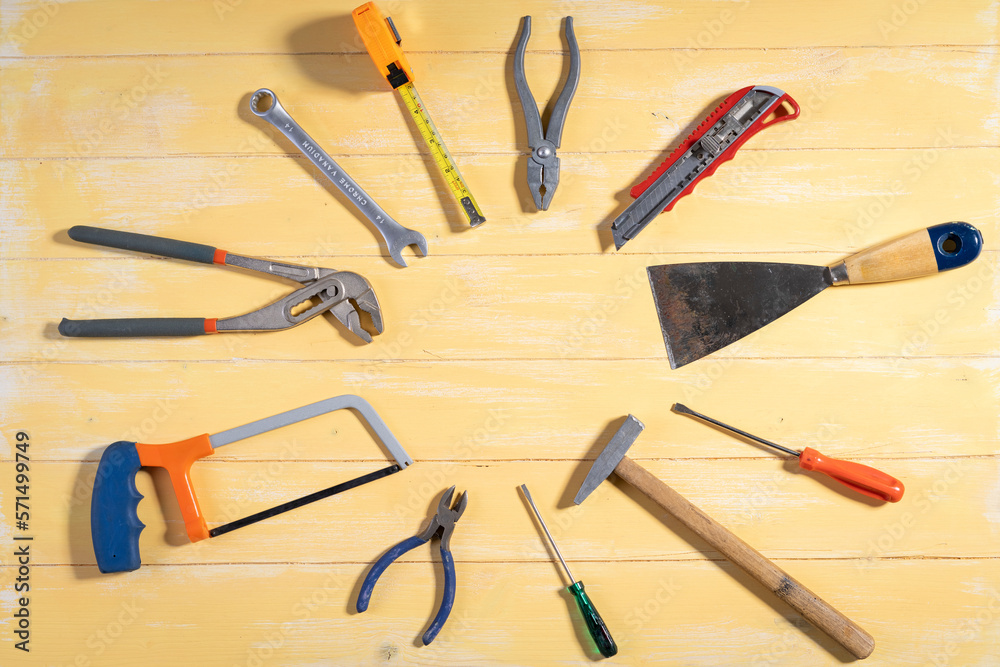 All tools supplies home construction on the yellow wooden background. Building tool repair equipments,copy space,industry engineer tool concept.still-life. All tools supplies home construction on the yellow wooden background. Building tool repair equipments,copy space,industry engineer tool concept.still-life.