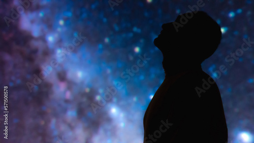 Silhouette of a man with Milky Way starry skies.