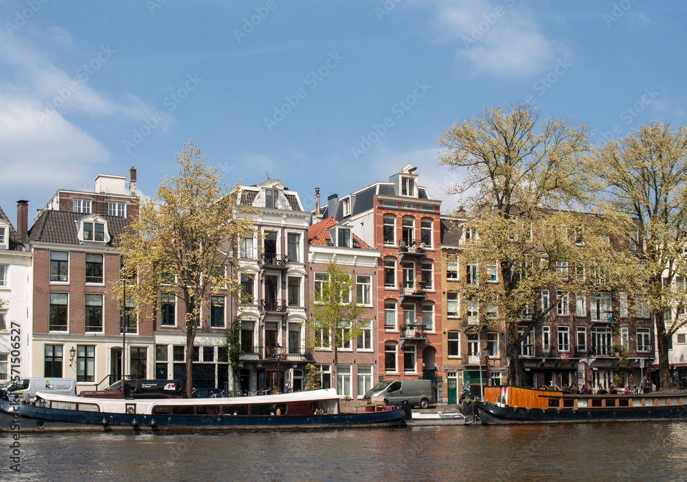 Traditional historic Dutch gable houses beside canal in Amsterdam The Netherlands