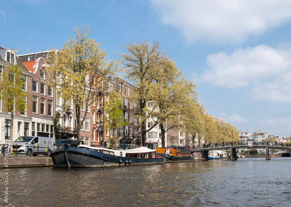 Traditional historic Dutch gable houses beside canal in Amsterdam The Netherlands