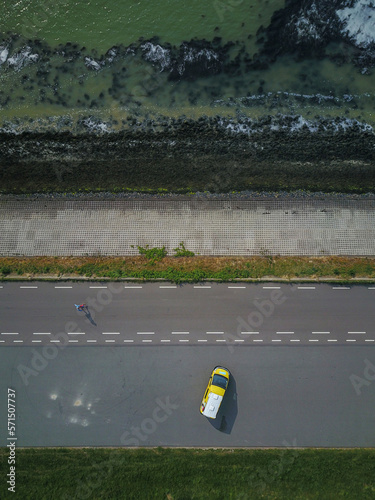 Campervan Parked By the Sea in the Netherlands from above, drone shot photo