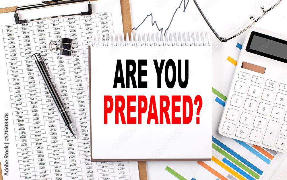 ARE YOU PREPARED text on notebook with chart, calculator and pen