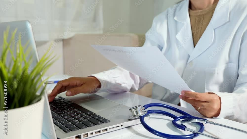Doctor or nurse woman in uniform with stethoscope working she typing ...