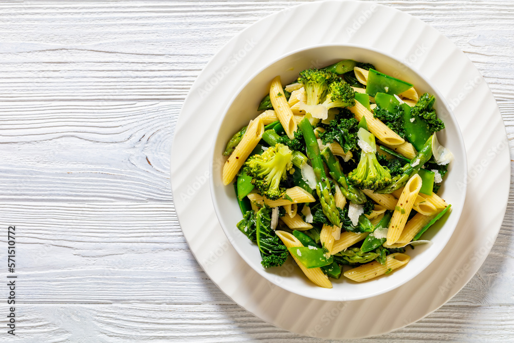 Pasta primavera with green veggies, cheese in bowl Pasta primavera with green veggies, cheese in bowl