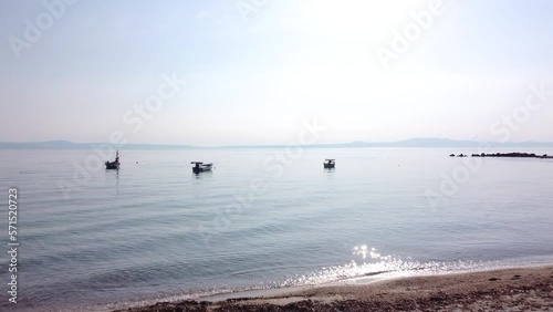 Peaceful Beach And Sea With Small Boats, Greece. Aerial View
