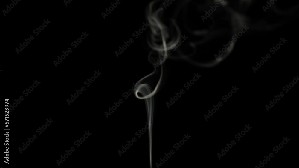 thin and swirling smoke trail from an extinguished candle on a black background thin and swirling smoke trail from an extinguished candle on a black background