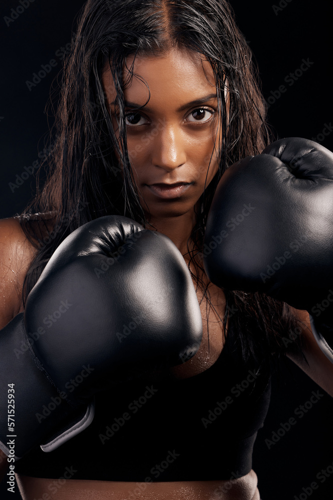 Boxing, gloves and portrait of woman on black background for sports, strong focus or mma training. Female boxer, workout or fist fight of impact, energy and warrior power for studio fitness challenge