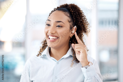 Happy, deaf and black woman with cochlear implant in office for communication, translation and speech on blurred background. Disability, hearing and female employee for sign language, hand or gesture photo