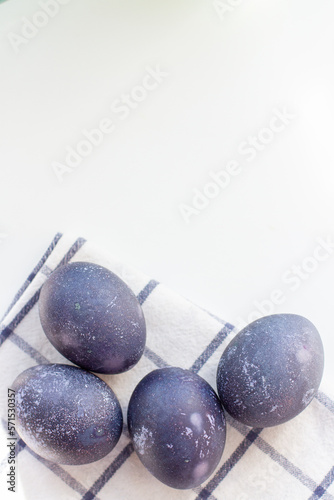 Dyed blue and marble easter eggs. Vertical