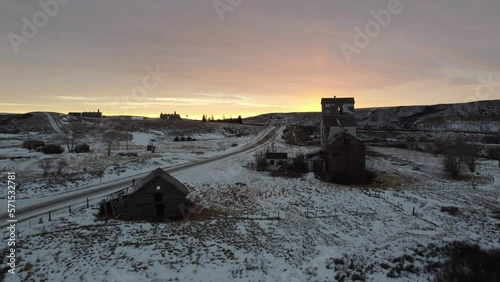 Old abandoned graine elevator in the ghost town of Sharples, Alberta at sunrise. photo