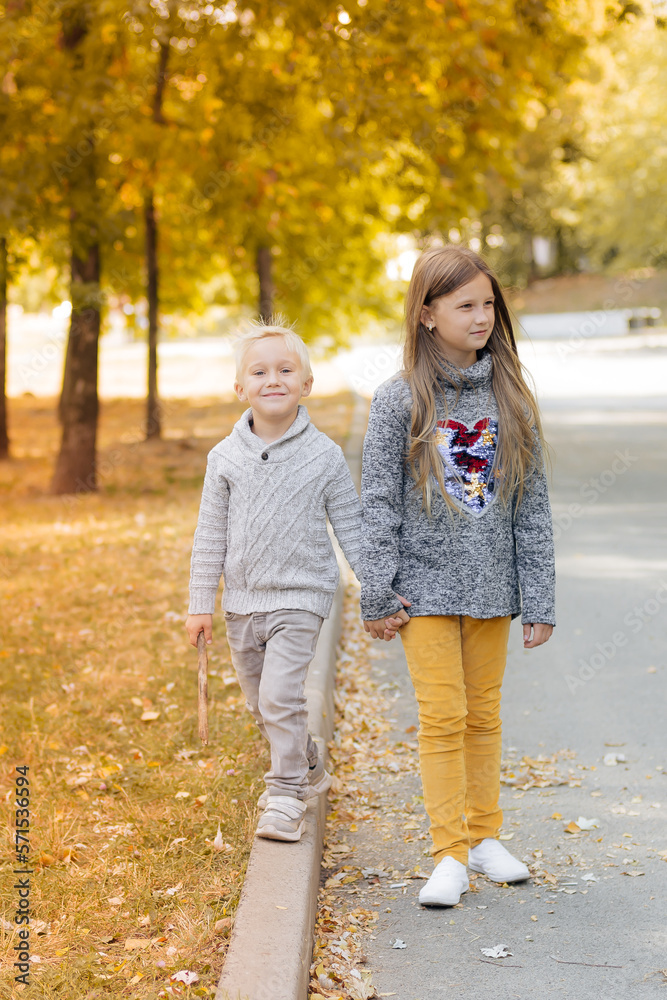 mother and daughter walking in the park mother and daughter walking in the park